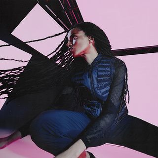 Female Model wearing the Belstaff Fenn Rollneck Jumper in Sand.