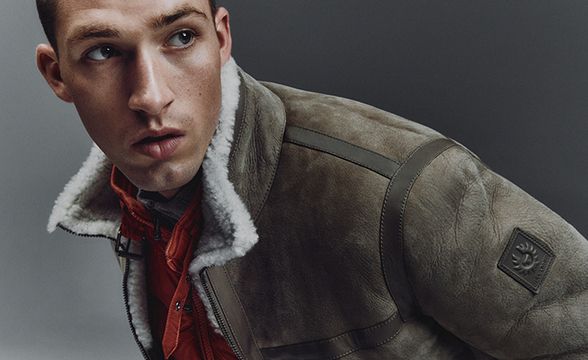 Model wearing Belstaff Tundra Jacket in Dark Sand/Natural with the Tonal Circuit Gilet in Amber.