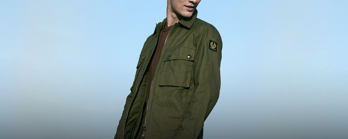 Model wearing Belstaff Tactical Overshirt in Pewter Green.