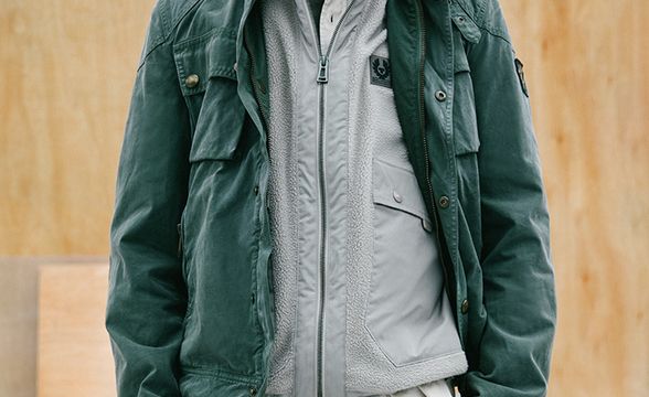Man wearing the Vintage Racemaster Jacket in Pewter Green.